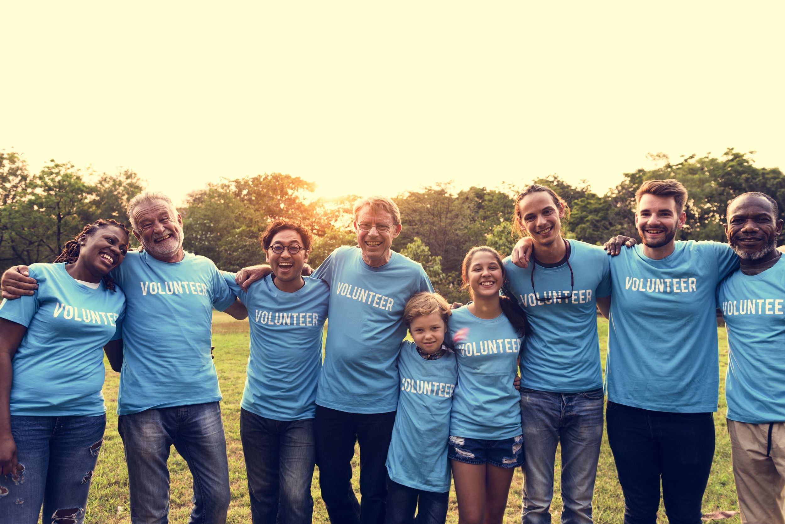 Volunteer team smiling together outdoors
