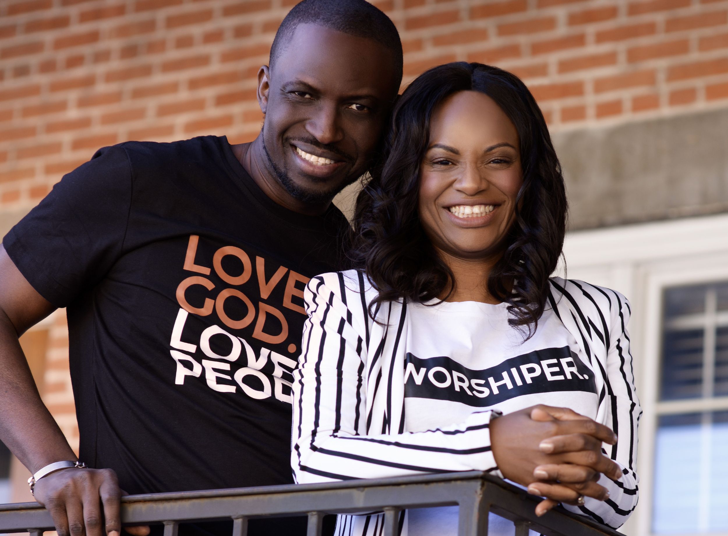 Pastor Tolu and Bola Adesanya smiling together outdoors
