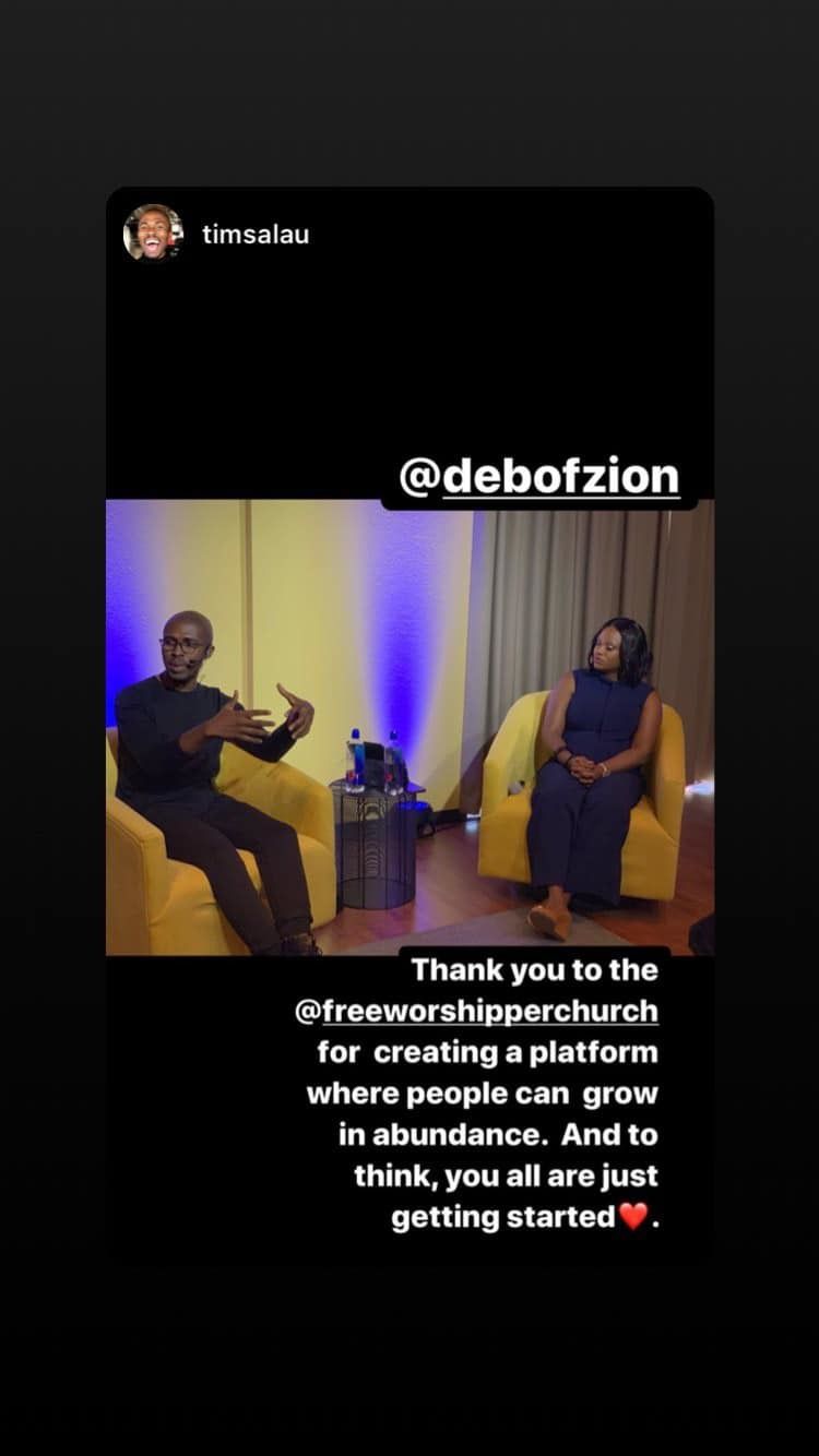 Conversation setting with two speakers seated in yellow chairs at a church event