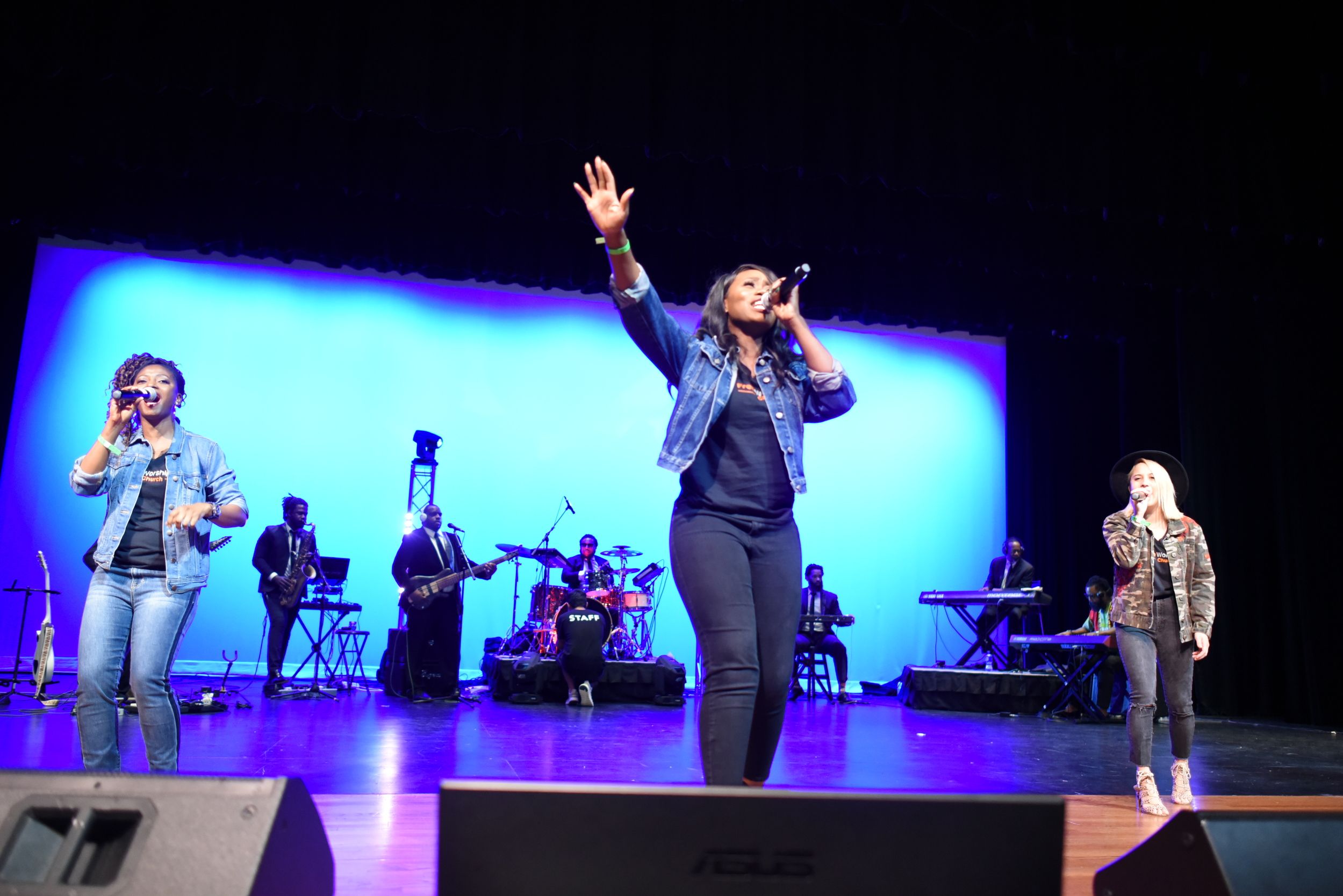 Worship team leading music on stage