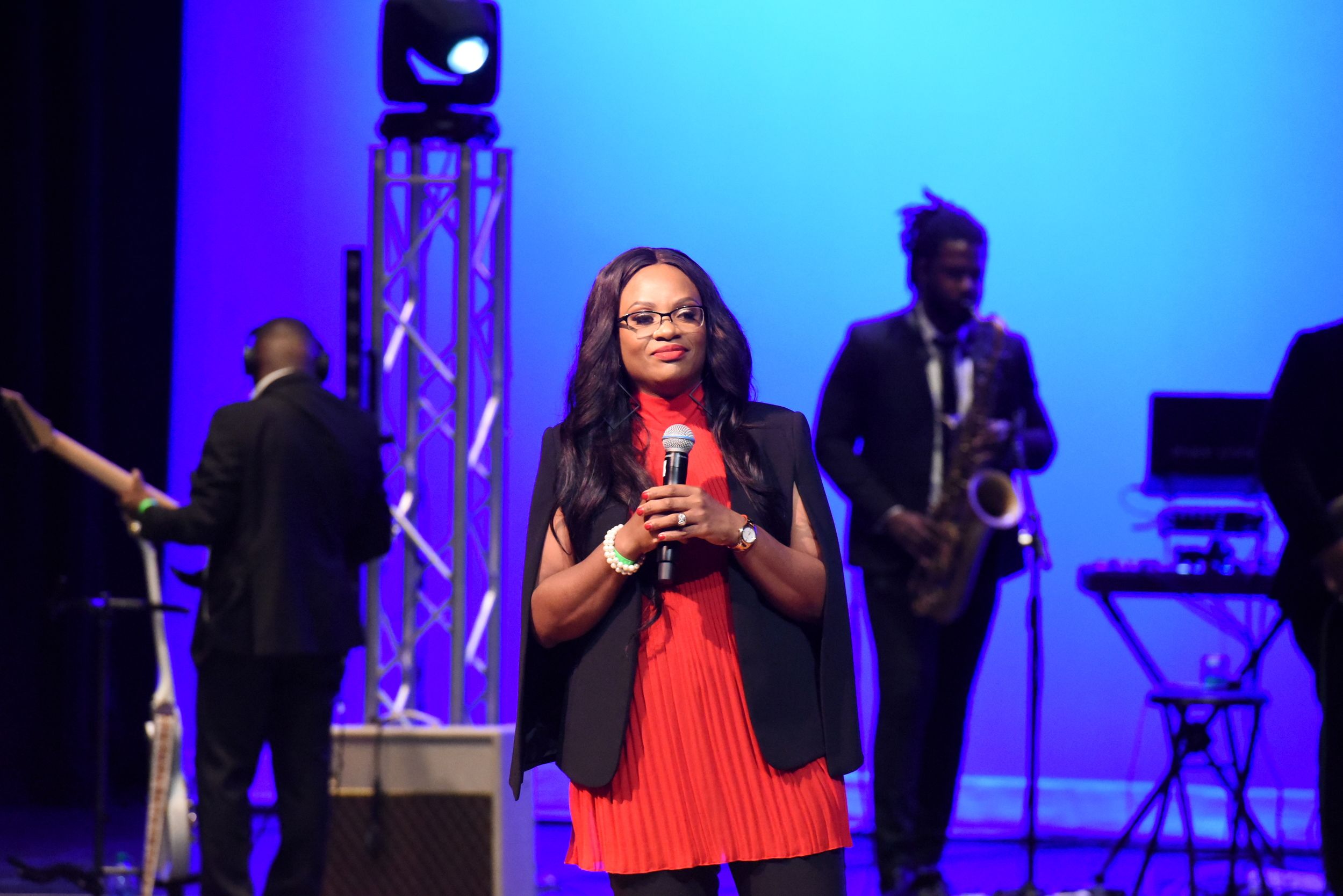 Woman speaking on stage during worship service