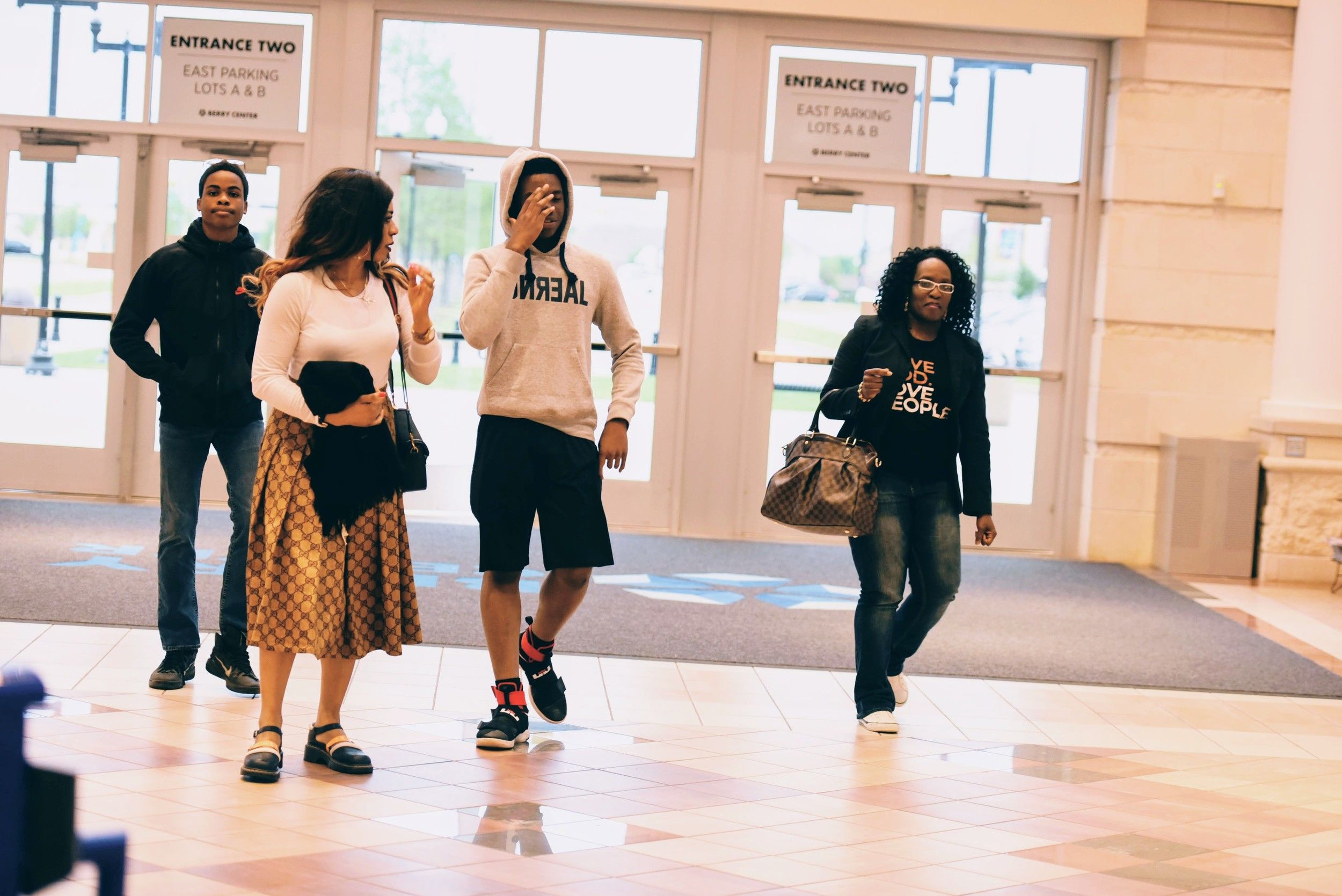 People arriving through the church entrance