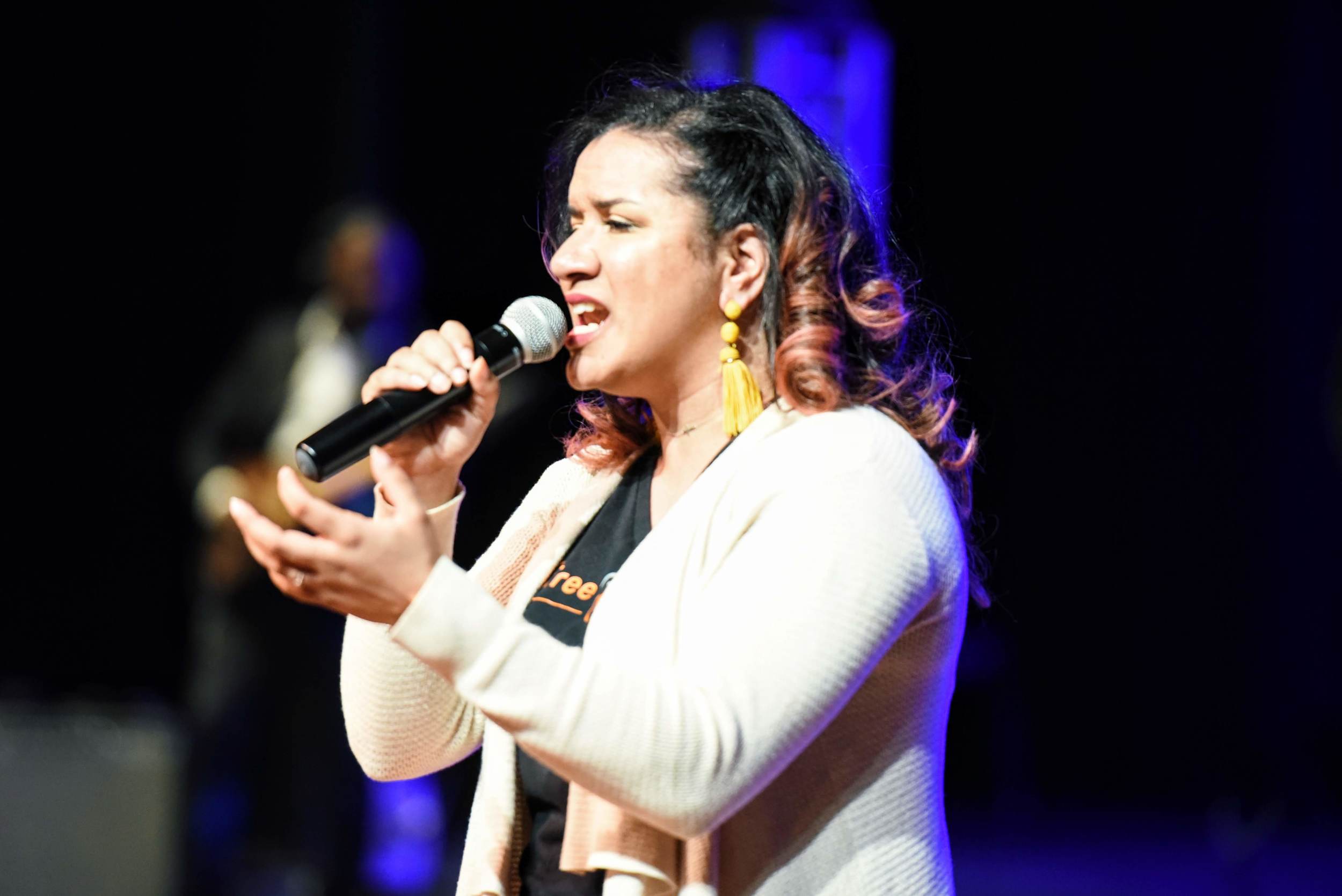 Woman singing during worship service