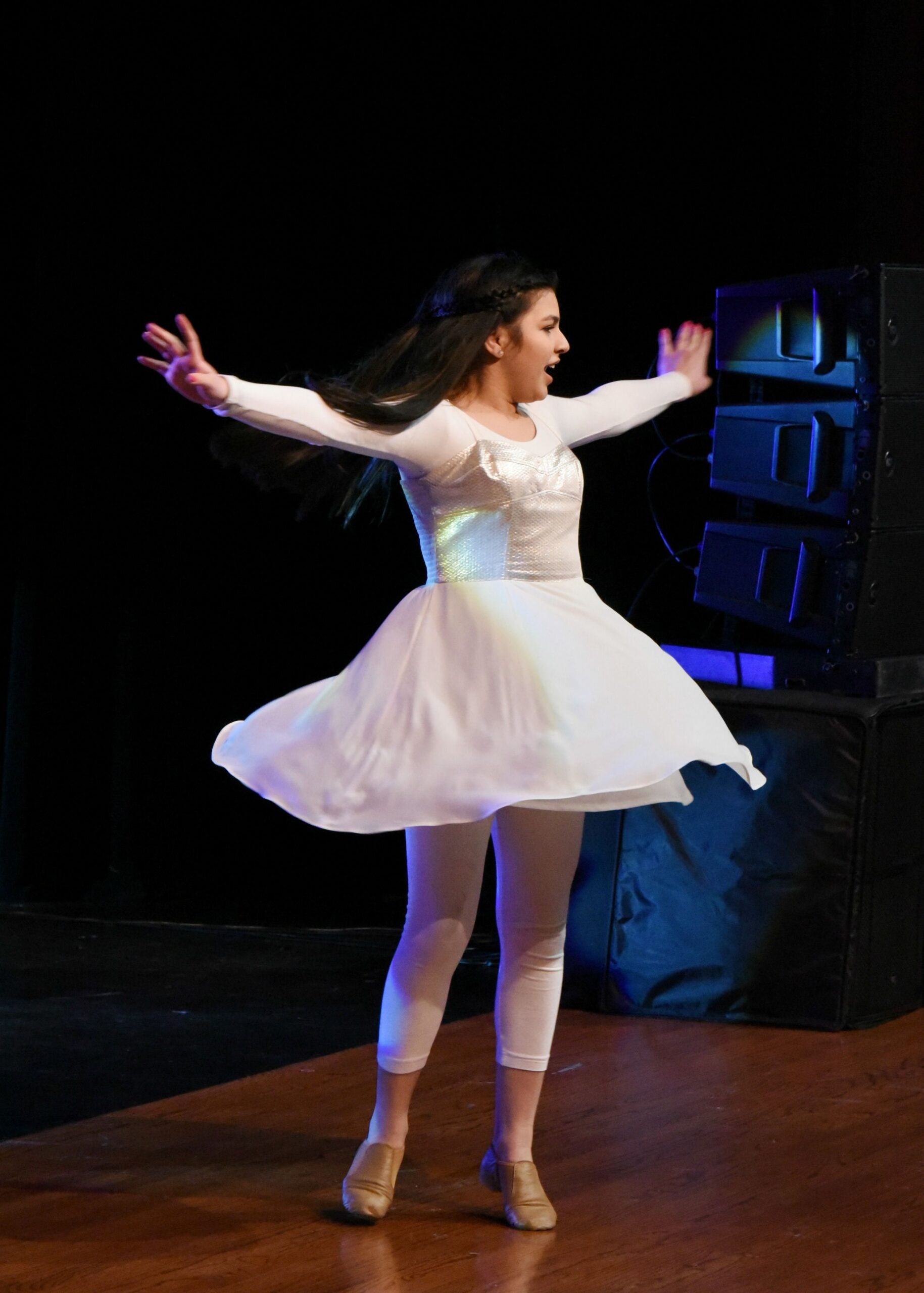 Young dancer performing on stage