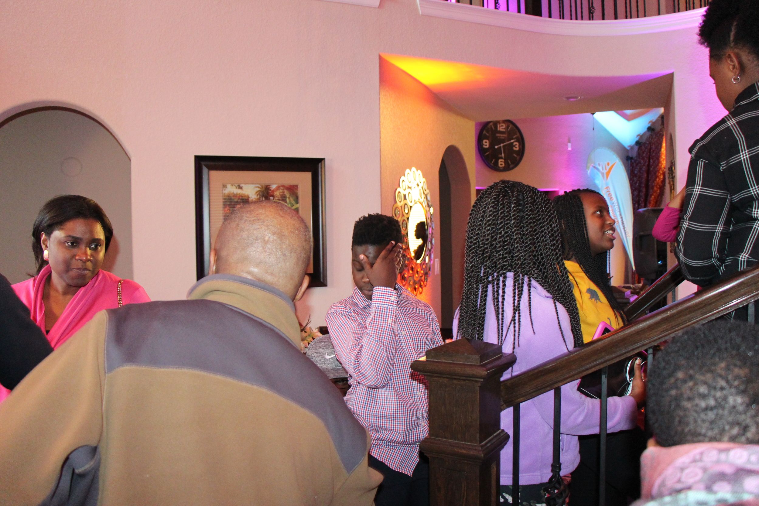 Guests gathering indoors during a Free Worshipper Church meet and greet